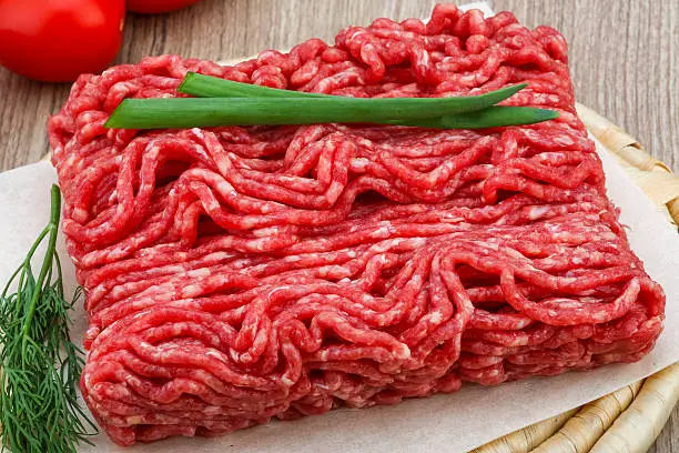 do you season ground beef before cooking?