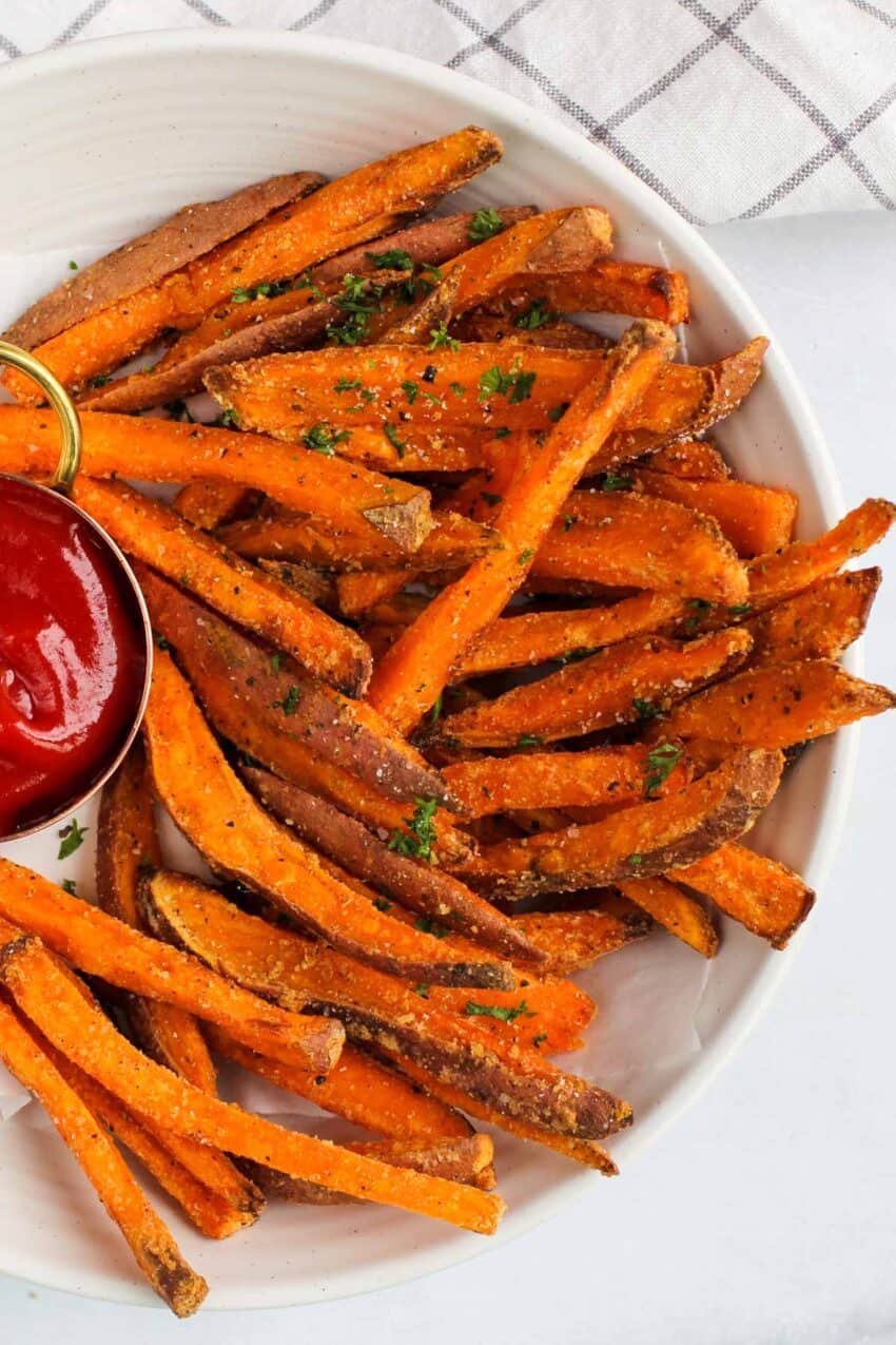 sweet potato fries served with ketchup 