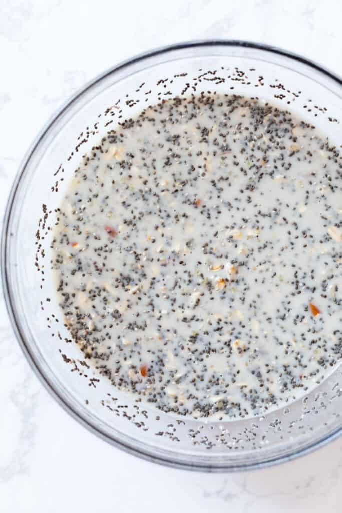Ingredients for chia pudding in a glass bowl.