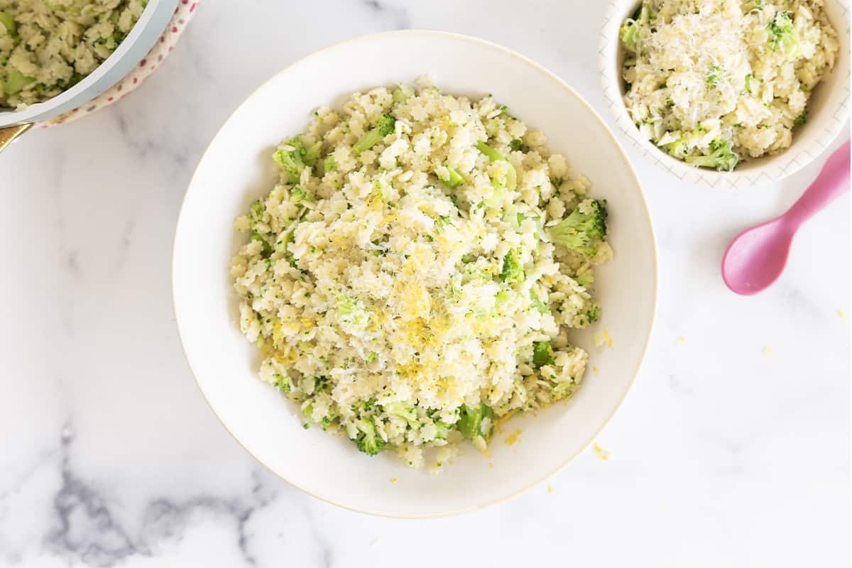 Lemon broccoli pasta in two bowls with spoon.