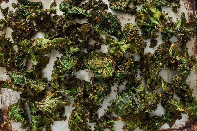 homemade crispy kale chips on a sheetpan homemade crispy kale chips on a sheetpan