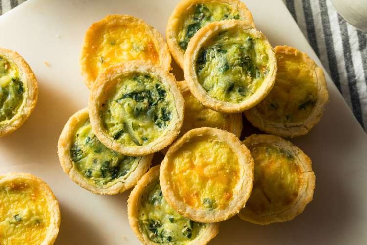 For a traditional baby shower food idea, make Mini Quiches.
