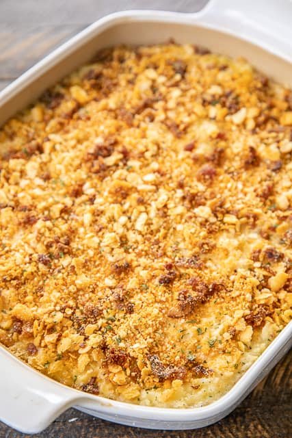 Pepper Jack Potato Casserole - our favorite potato casserole recipe. It is like a cross between traditional potato casserole and scalloped potatoes. LOVE the cheesy bacon cracker crust!!! Frozen shredded hash browns, cream of chicken soup, heavy cream, pepper jack cheese, butter, sour cream, onion powder, garlic powder, ritz crackers, parmesan and bacon. Can make ahead and freeze for later. I always have a batch on hand for a quick and delicious side dish! Pepper Jack Potato Casserole - our favorite potato casserole recipe. It is like a cross between traditional potato casserole and scalloped potatoes. LOVE the cheesy bacon cracker crust!!! Frozen shredded hash browns, cream of chicken soup, heavy cream, pepper jack cheese, butter, sour cream, onion powder, garlic powder, ritz crackers, parmesan and bacon. Can make ahead and freeze for later. I always have a batch on hand for a quick and delicious side dish!