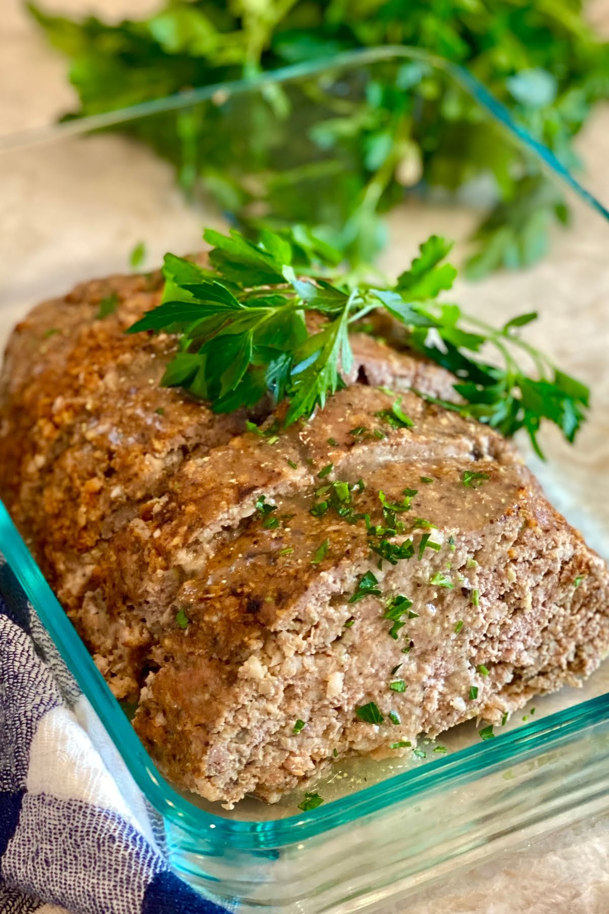 a turkey meatloaf with mushrooms sliced and stored in a glass container