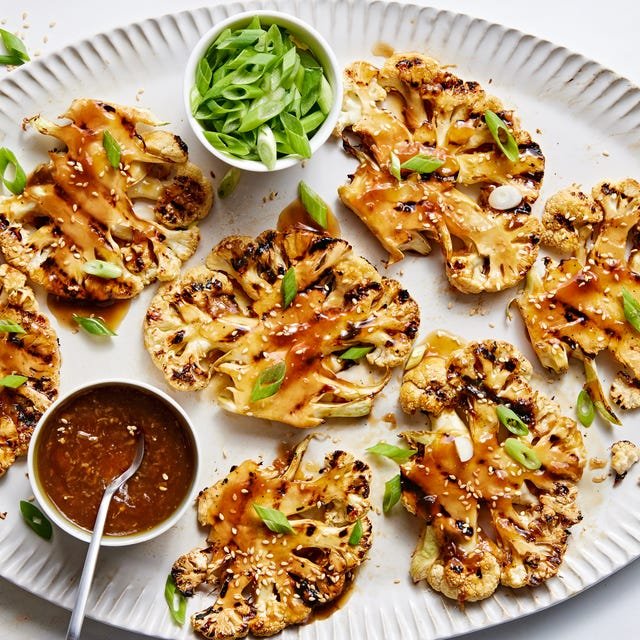 Grilled teriyaki cauliflower steaks grilled teriyaki cauliflower steaks on a platter with more teriyaki sauce and scallions