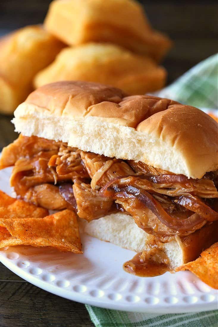 slow cooker chicken on a bun with potato chips