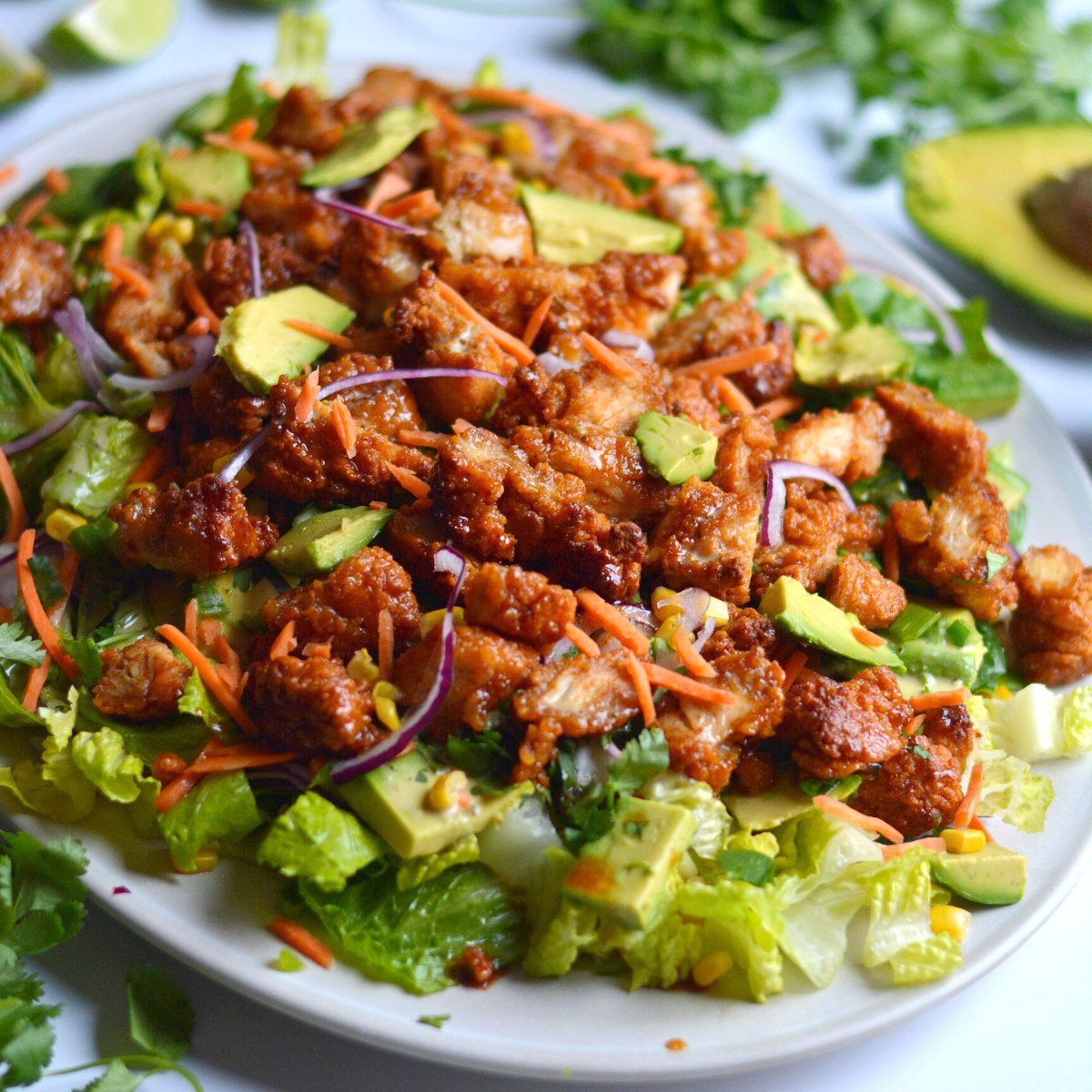 crispy & spicy honey lime chicken avocado salad