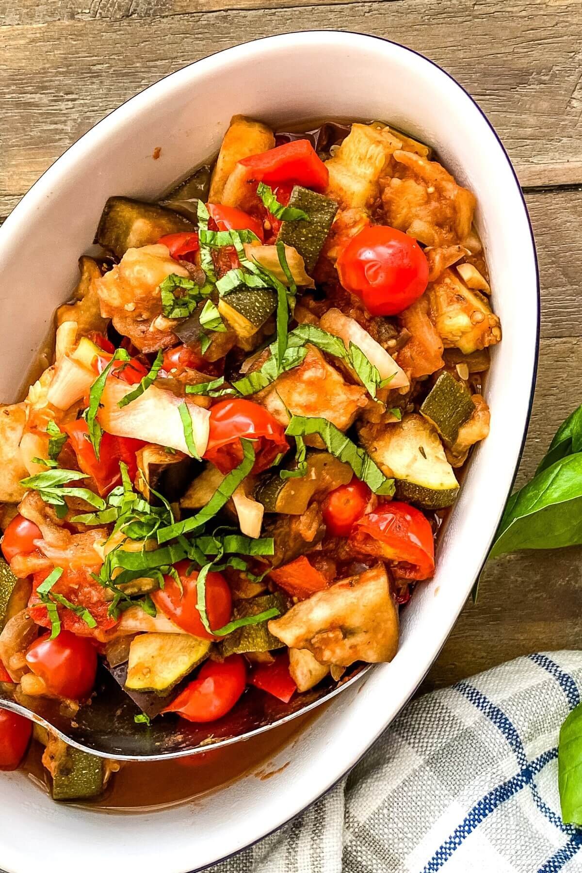 blue and white dish with ratatouille.