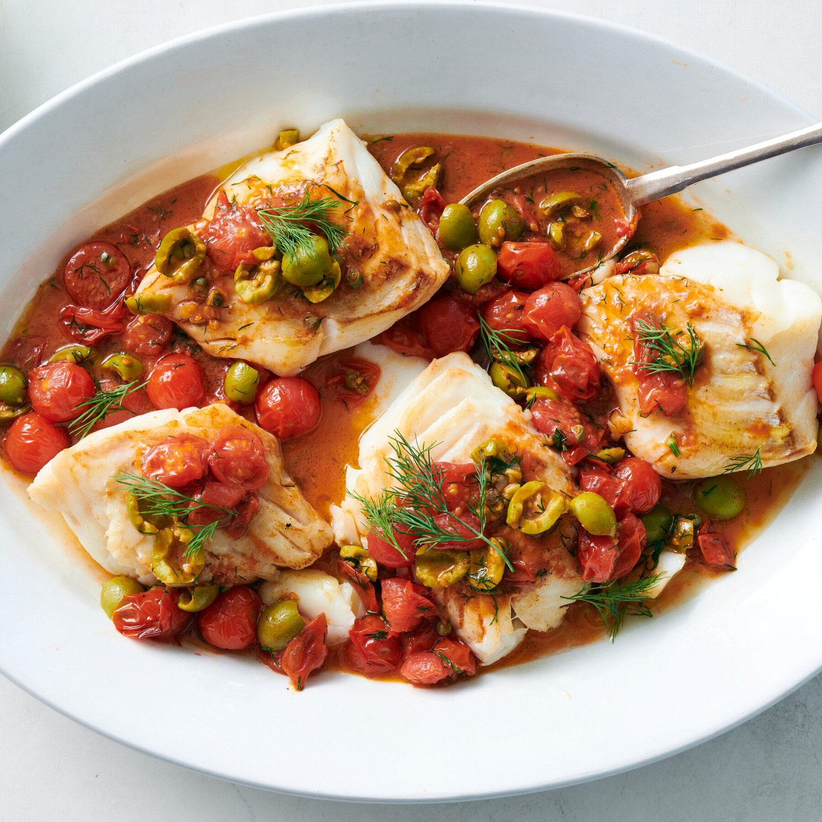 Roasted Cod With Burst Tomatoes and Olives